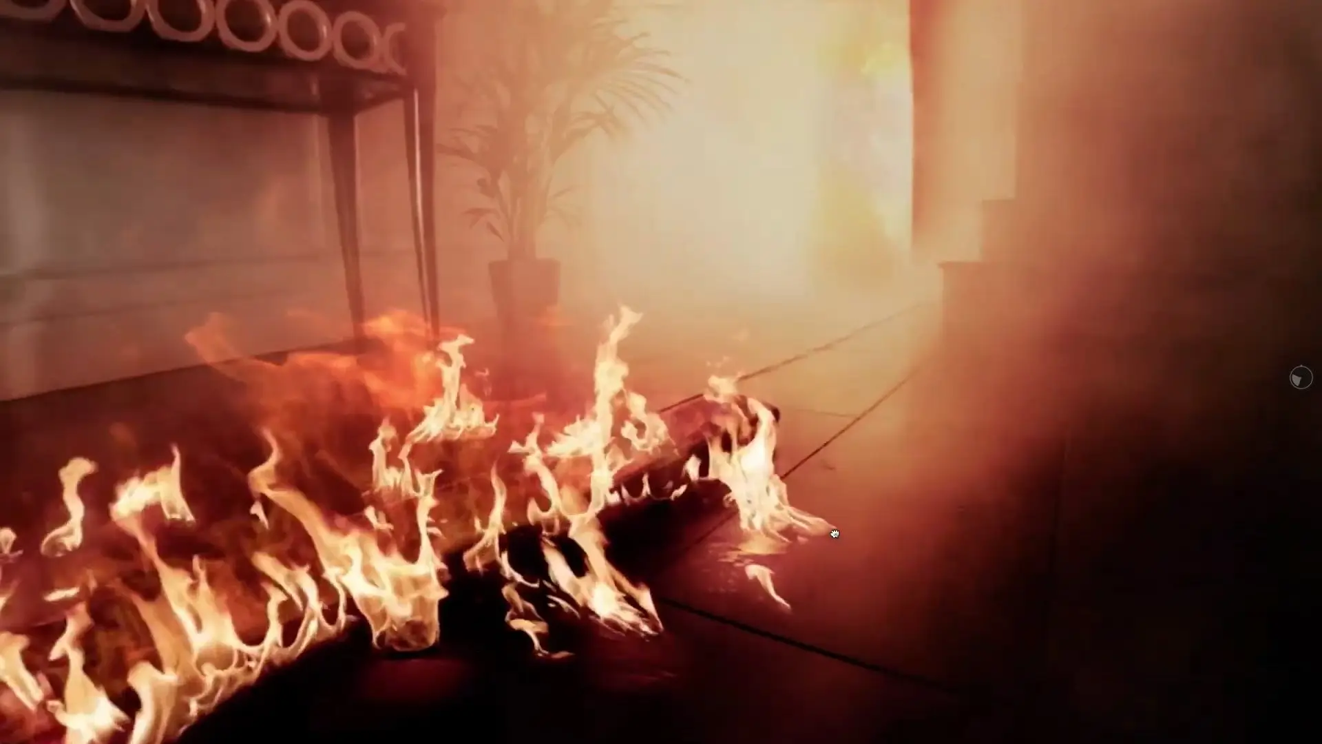 A frame from the film: flames run along a hallway floor past a console table and a potted palm, in thick orange smoke