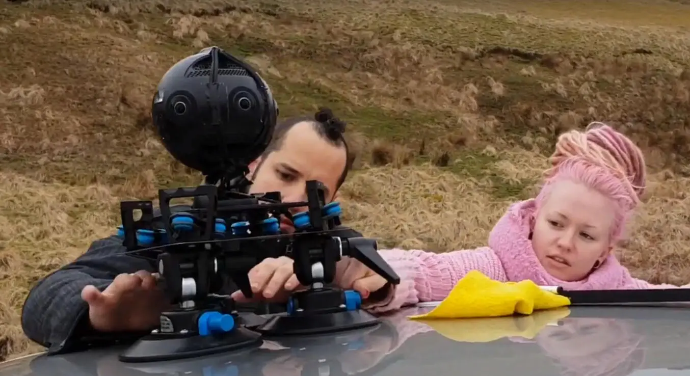 A 360 camera on a suction car mount, being fixed in place on a hillside